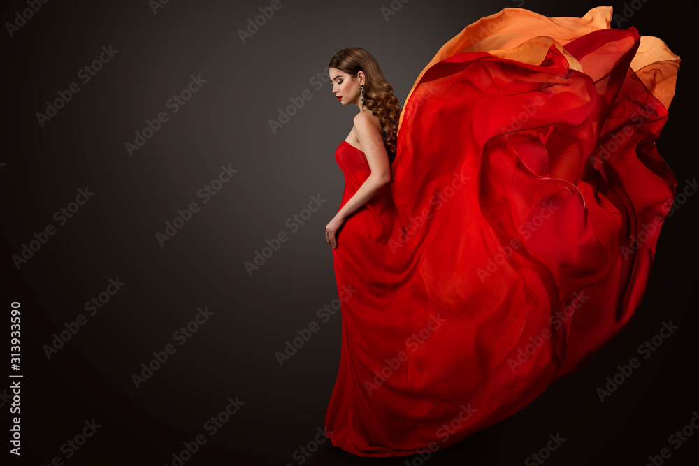 Fototapeta Woman Red Dress Flying on Wind, Beautiful Fashion Model in Fluttering Gown studio Portrait