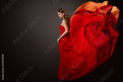 Woman Red Dress Flying on Wind, Beautiful Fashion Model in Fluttering Gown studio Portrait