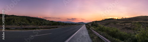 Pink sunset on the road