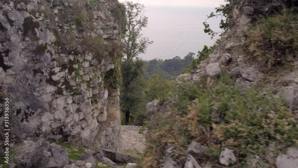 Overlooking mountain valley covered with forest near sea from top of mountain. Overlooking mountain valley covered with forest near sea from top of mountain.