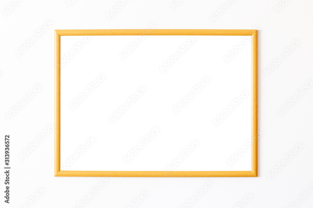 Empty wooden square frame in front of white wall Empty wooden square frame in front of white wall