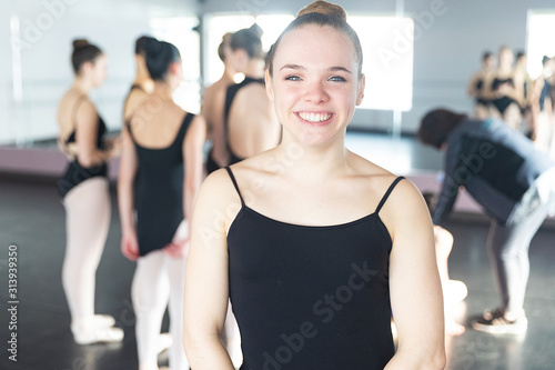 Happy teenage girl in dance practice smiling