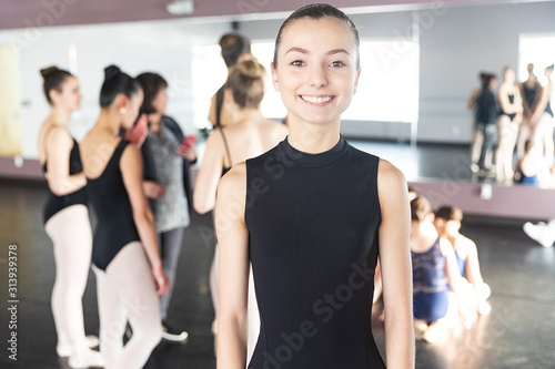 Happy teenage girl in dance practice smiling