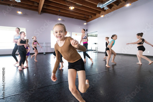 Group of kids jumping and playing in dance class