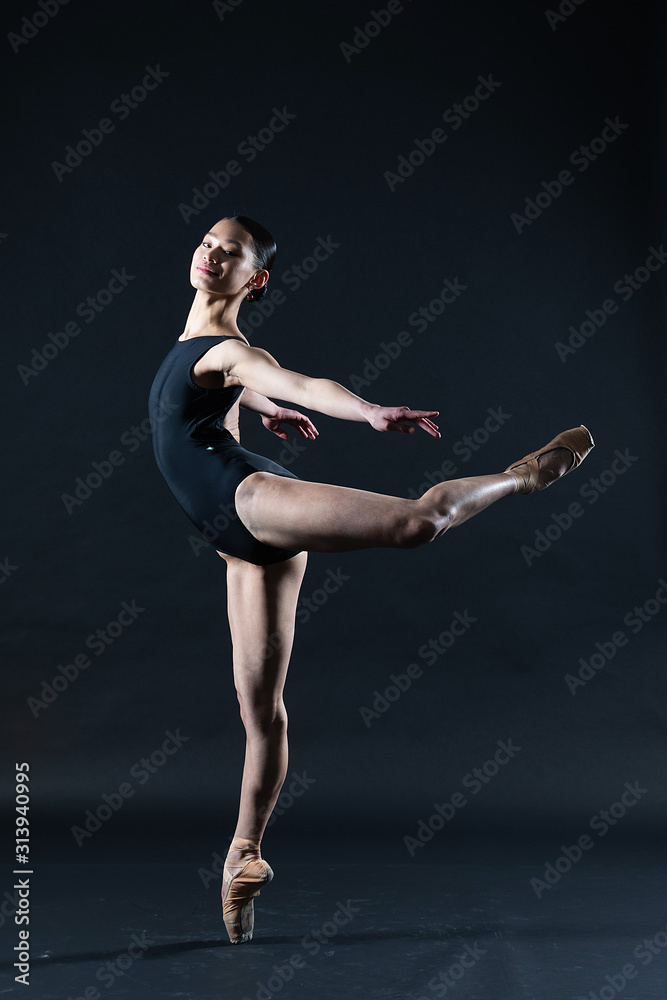Teenage Asian girl in ballet dance pose for portrait