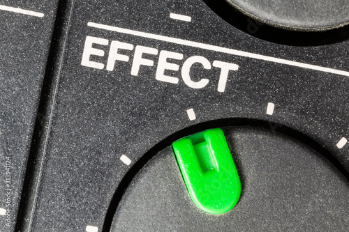 Macro close up view of vintage tape machine effect volume dial.