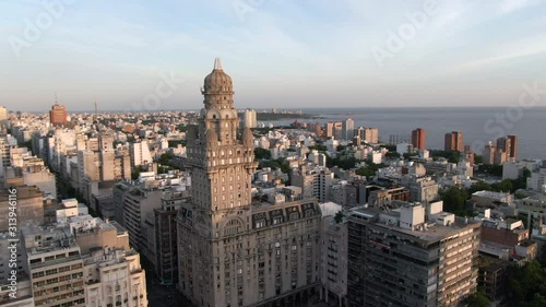 Montevideo, Uruguay, aerial view of cityscape showing architectural landmark Palacio Salvo in the Old City at sunset.