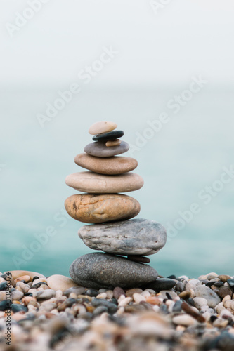 Stack of pebble stones on the beach. Spa and spiritual concept