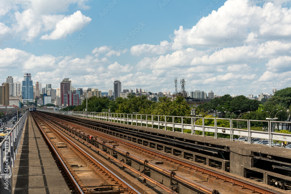 Urban train rail in Sao Paulo, Brazil, with buildings at the backside. Urban train rail, with buildings at the backside.