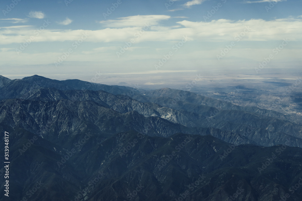 Beautiful view of mountains while watching out of the plane window approaching Los Angeles