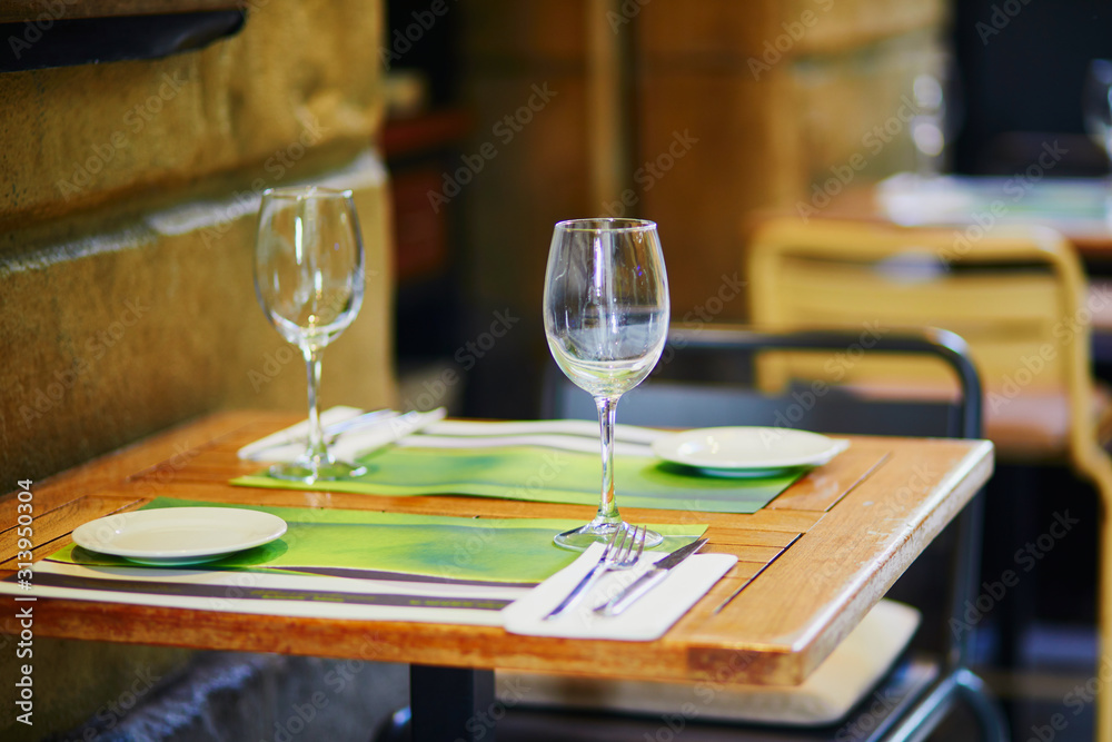 Empty wine glasses on street bar table in San Sebastian, Spain Empty wine glasses on street bar table in San Sebastian, Spain