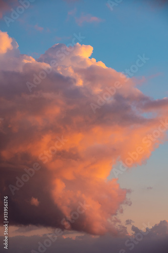 Red sky clouds background. Beautiful landscape with clouds and orange sun on sky © britaseifert