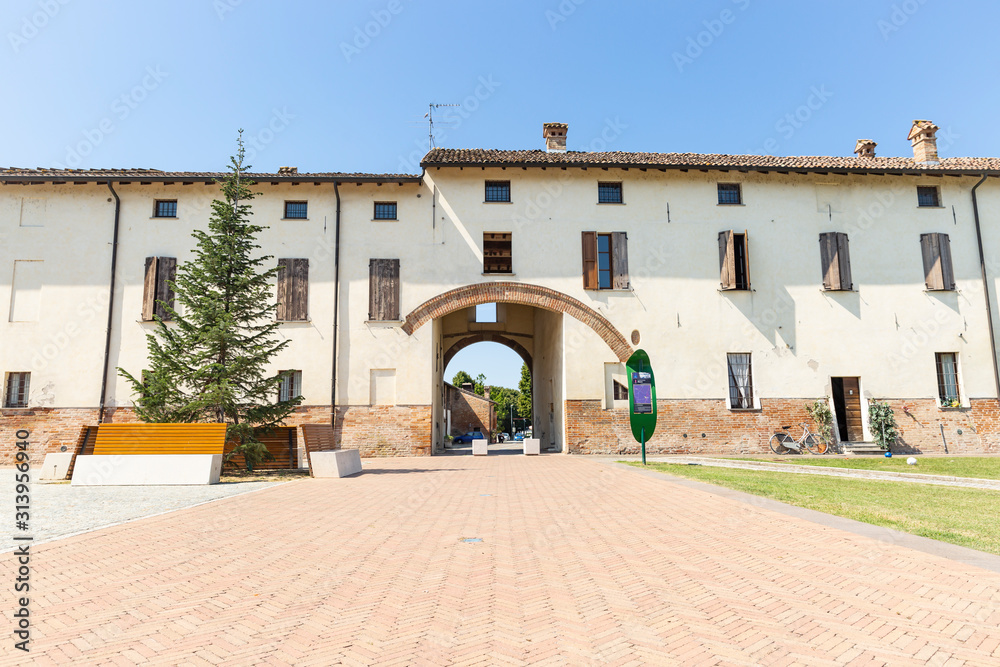 a street with an arch in Chiaravalle della Colomba (Alseno), Province of Piacenza, Emilia-Romagna region, Italy