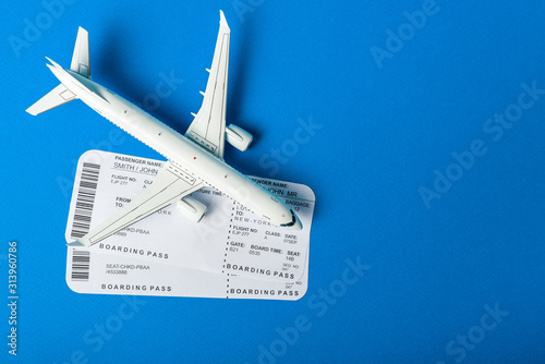 Aircraft top view, Airline boarding pass tickets on the desk. The journey begins. Travel concept with empty space for text photo