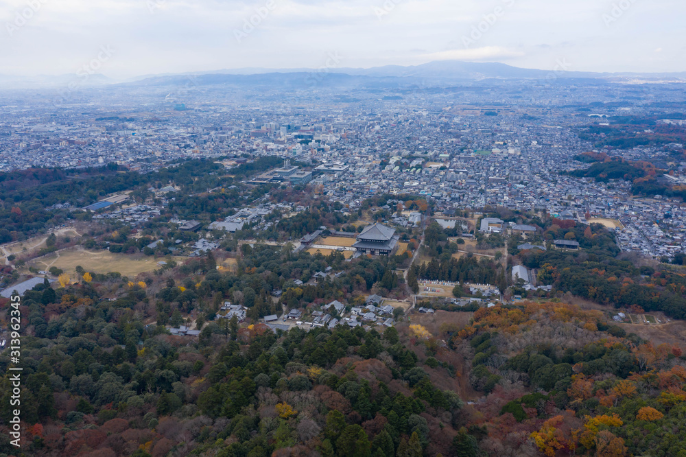 High aerial view of Nara city, Todaiji temple stands at base of Mt Wakakusa