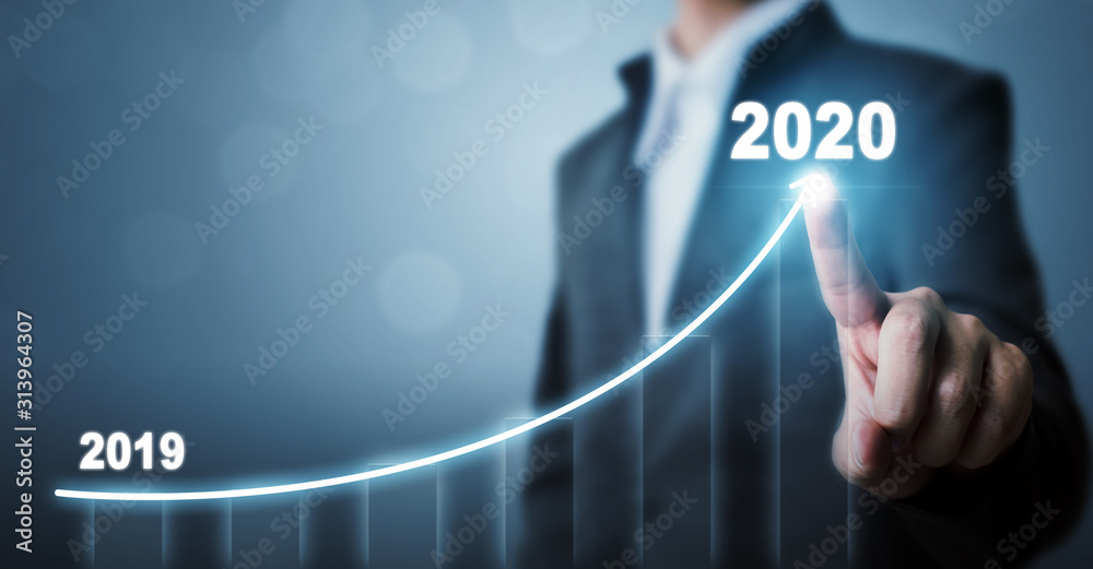 Business development to success in 2020 concept. Businessman pointing arrow graph corporate future growth plan - obrazy, fototapety, plakaty 