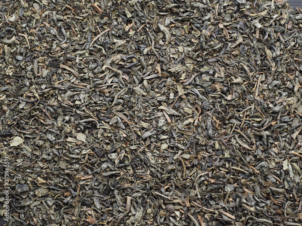 Organic dried green tea leaves. Background. top view. Organic dried green tea leaves. Background. top view.
