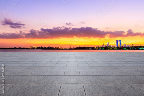 Empty square floor and modern city skyline with buildings in suzhou at night,China. © ABCDstock