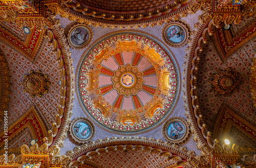 Photography Detail of the dome of the Church of San Diego in Morelia, Michoacan, Mexico, with gold painting and a Baroque style