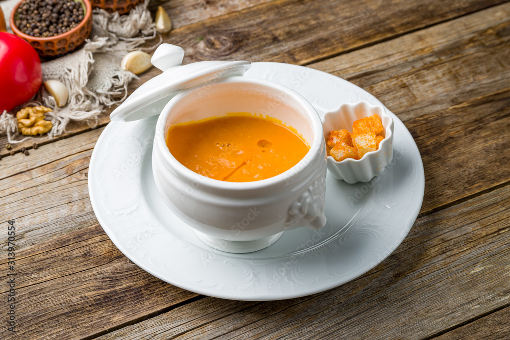 Soup cream of pumpkin on wooden table Soup cream of pumpkin on wooden table