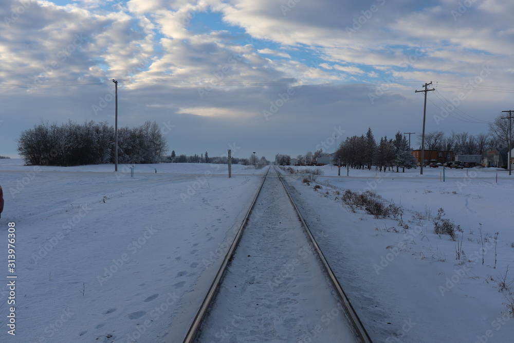 A view down train tracks in winter