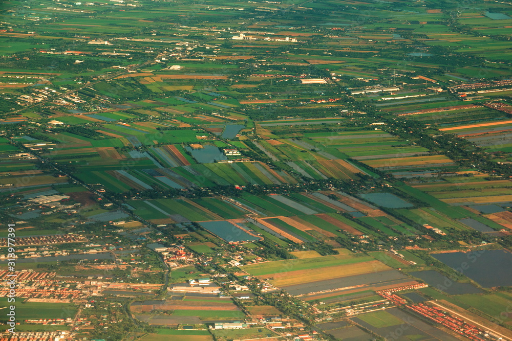 Aerial view of countryside area and green rice fields in beside Chao Phraya river. Aerial view of countryside area and green rice fields in beside Chao Phraya river.