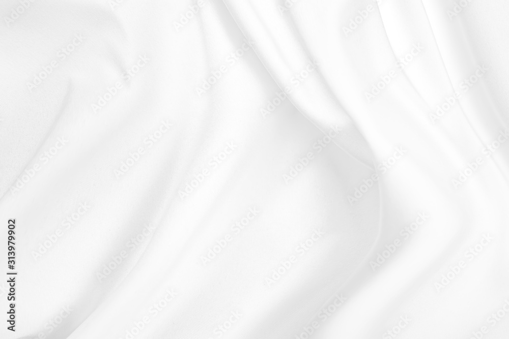 Abstract white fabric texture background. Cloth soft wave. Creases of satin, silk, and cotton.