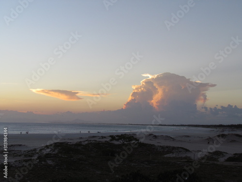 Thousand megaton clouds illuminated by the sunset.