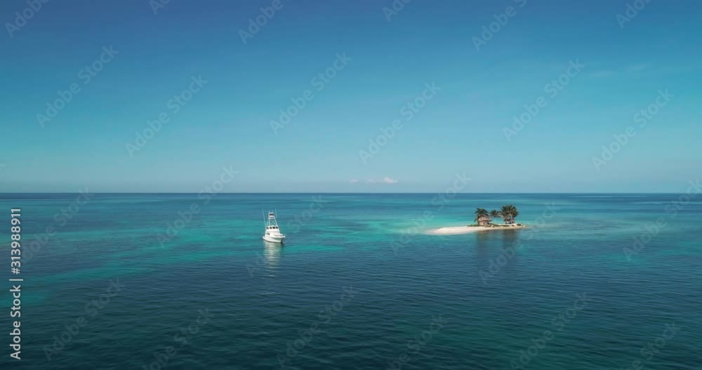 Slow beautiful aerial forward of yacht in the tropical water of the Caribbean Sea Slow beautiful aerial forward of yacht in the tropical water of the Caribbean Sea