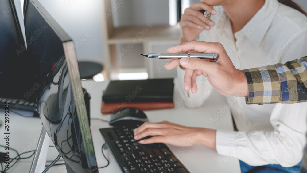 Pensive programmer working on desktop pc programming code technologies or website design at office Software Development Company Pensive programmer working on desktop pc programming code technologies or website design at office Software Development Company