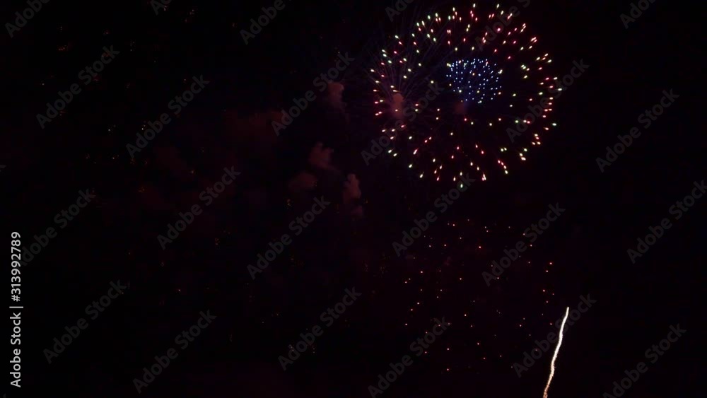 Beautiful abstract colourful Fireworks explode display on sky at night a symbol of celebration in New years anniversary for background