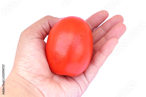 Picture of a bright red tomato on a white background