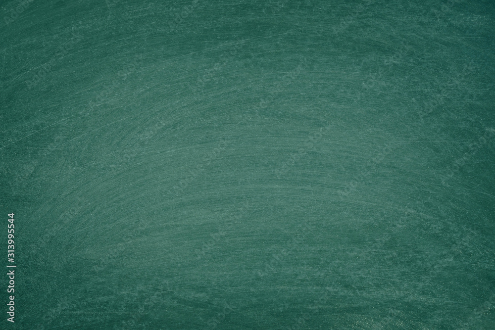 Fototapeta premium Working place on empty rubbed out on green board chalkboard texture background for classroom or wallpaper, add text message.