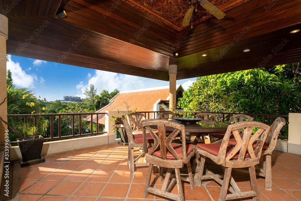 Fototapeta premium Outdoor dining wood table in the house