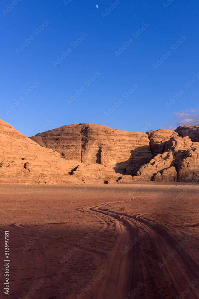 Fototapeta premium Wadi Ram desert with car., Red sand Dune in the Wadi Ram desert. Jordan landscape