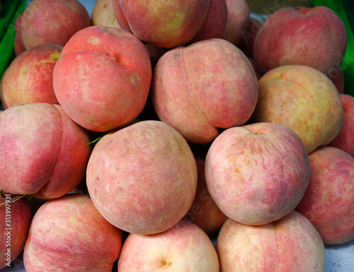 Sweet red ripe peaches at the rural market