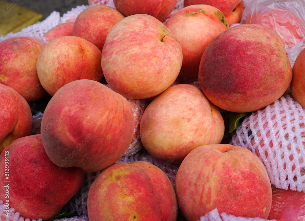 Sweet red ripe peaches at the rural market Sweet red ripe peaches at the rural market
