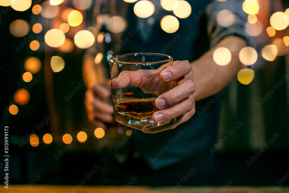 Whisky is poured into glass Beautiful bokeh