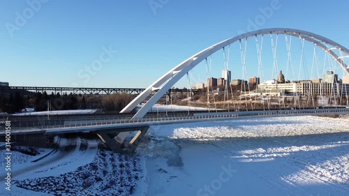 Walterdale Bridge crosses over frozen North Saskatchewan river in winter photo