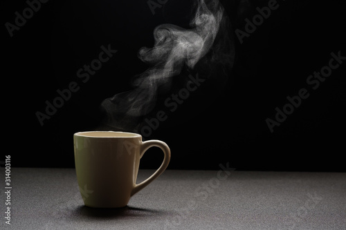 Water hot on wooden table,drink steam and copy space ,selective focus. Beverage warm concept