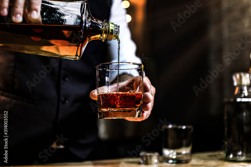 Bartender Serve Whiskey, on wood bar,