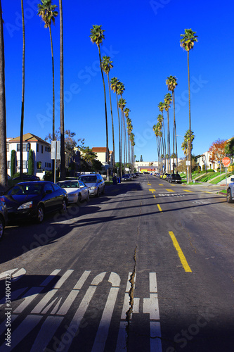 A small road between a residential building in Koreatown in Los Angeles. Sleeping area in Los Angeles. Sunny Yanar Day in Los Angeles.