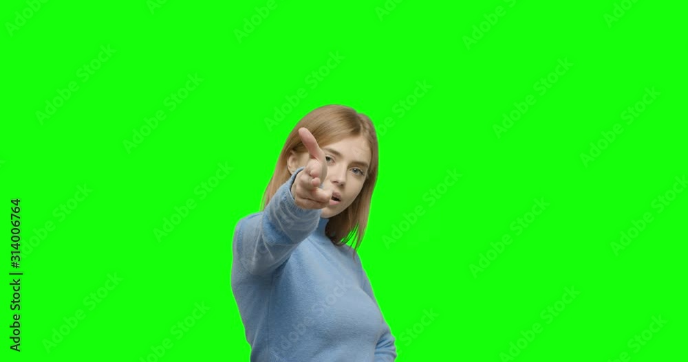 Girl shooting gesture on green screen