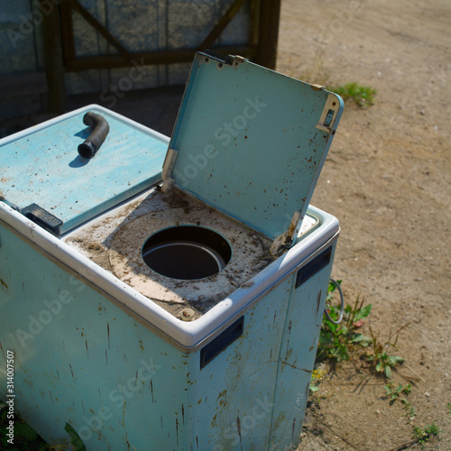 discarded old washine machine photo