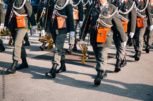 Photography Soldiers of Austrian army marching during parade in sunny autumn day in Vienna