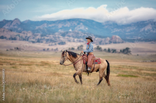 Cowgirl on Buckskin © Terri Cage 