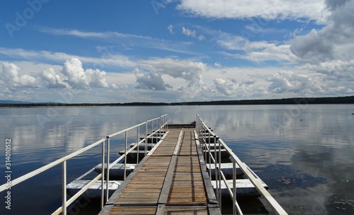 Picturesque place on the lake. Shore, Marina, water and beautiful Sunny weather.