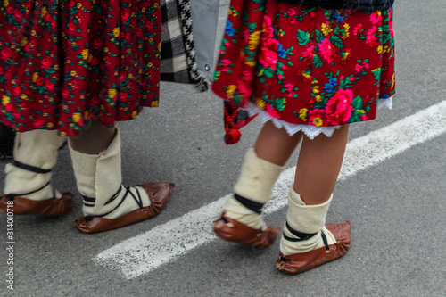 Sighetu Marmatiei, Romania: Maramures traditional costumes. Traditional Romanian peasant sandals which is worn with the Romanian peasant costume at Winter Customs and Traditions Marmatia Festival photo