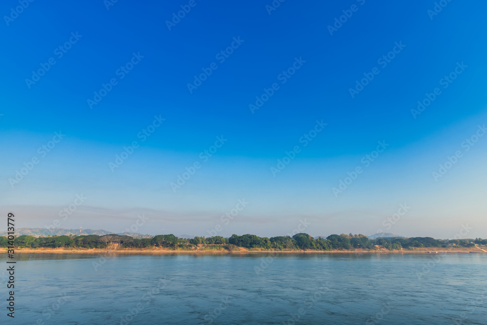 Beautiful early morning sunrise air atmosphere bright blue sky background abstract clear texture with white cloud of Mae Khong river