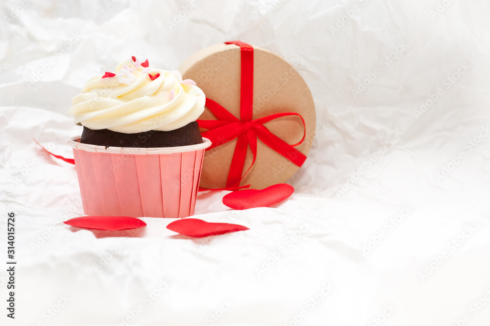 Valentine's day. Festive cake with cream and sprinkled with small hearts. The sweetness on birthday. Valentine's day cake. Valentine's day. Festive cake with cream and sprinkled with small hearts. The sweetness on birthday. Valentine's day cake.